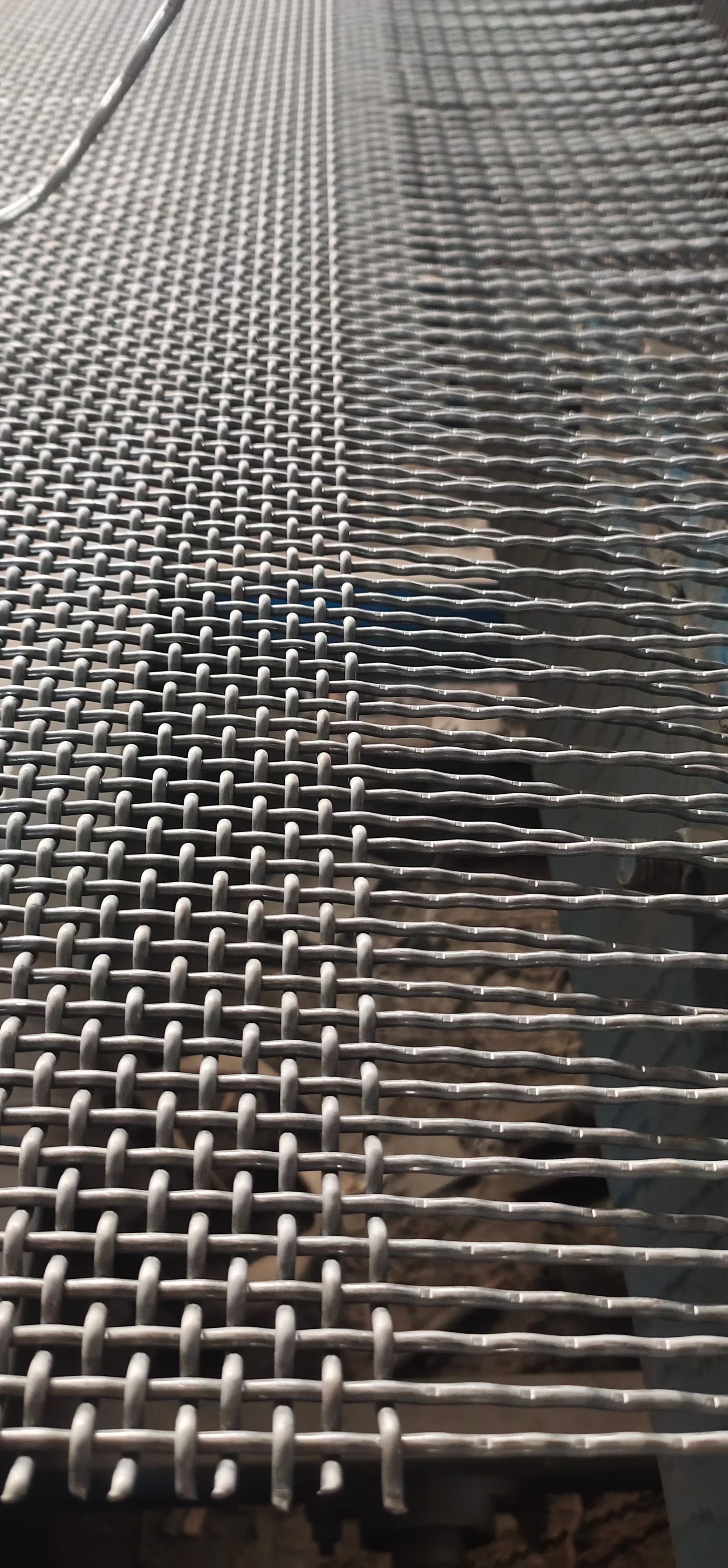 Close-up of woven wire screen structure